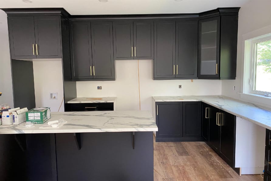 Kitchen Renovation — Black Cabinetry & Marble Island
